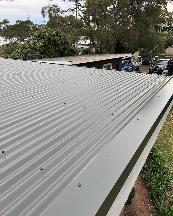 Gutter cleaning on a Gorokan house